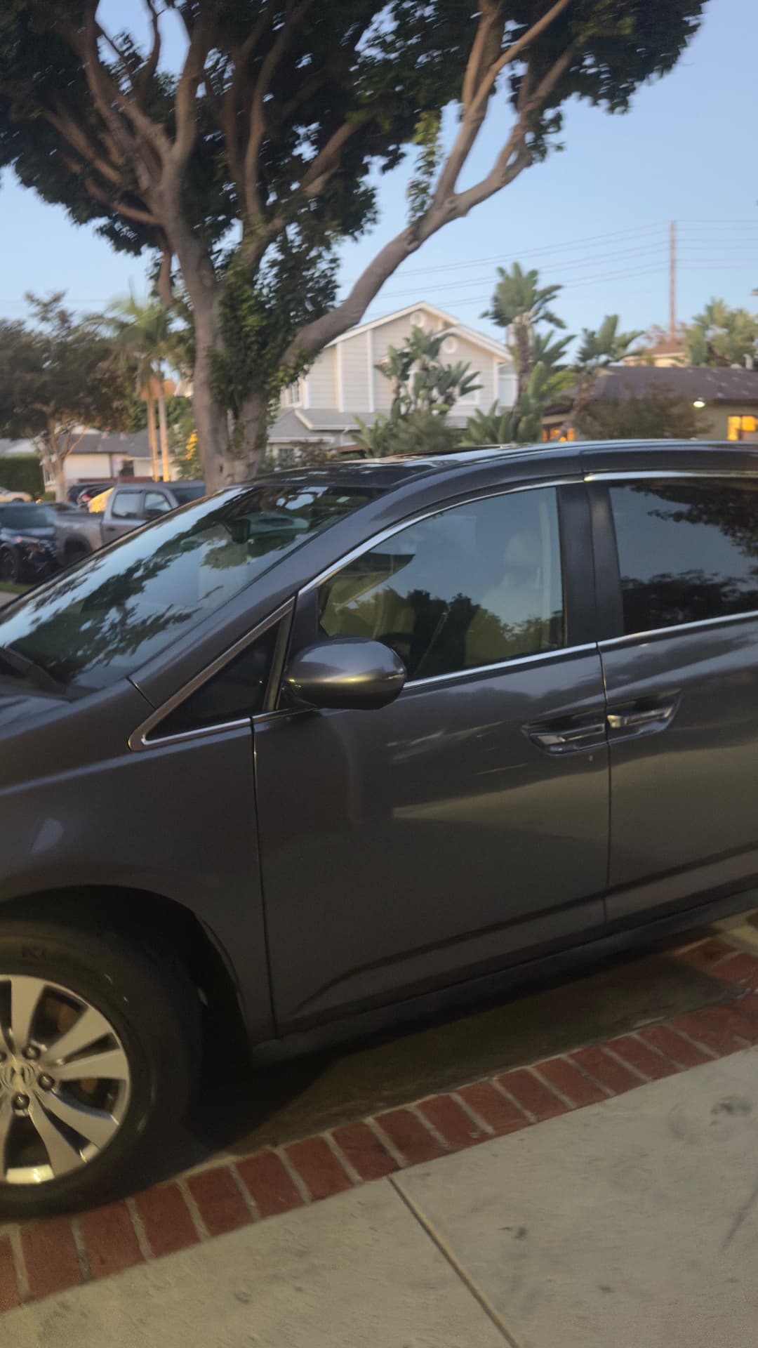 Gray Honda minivan detailed at the customer's home