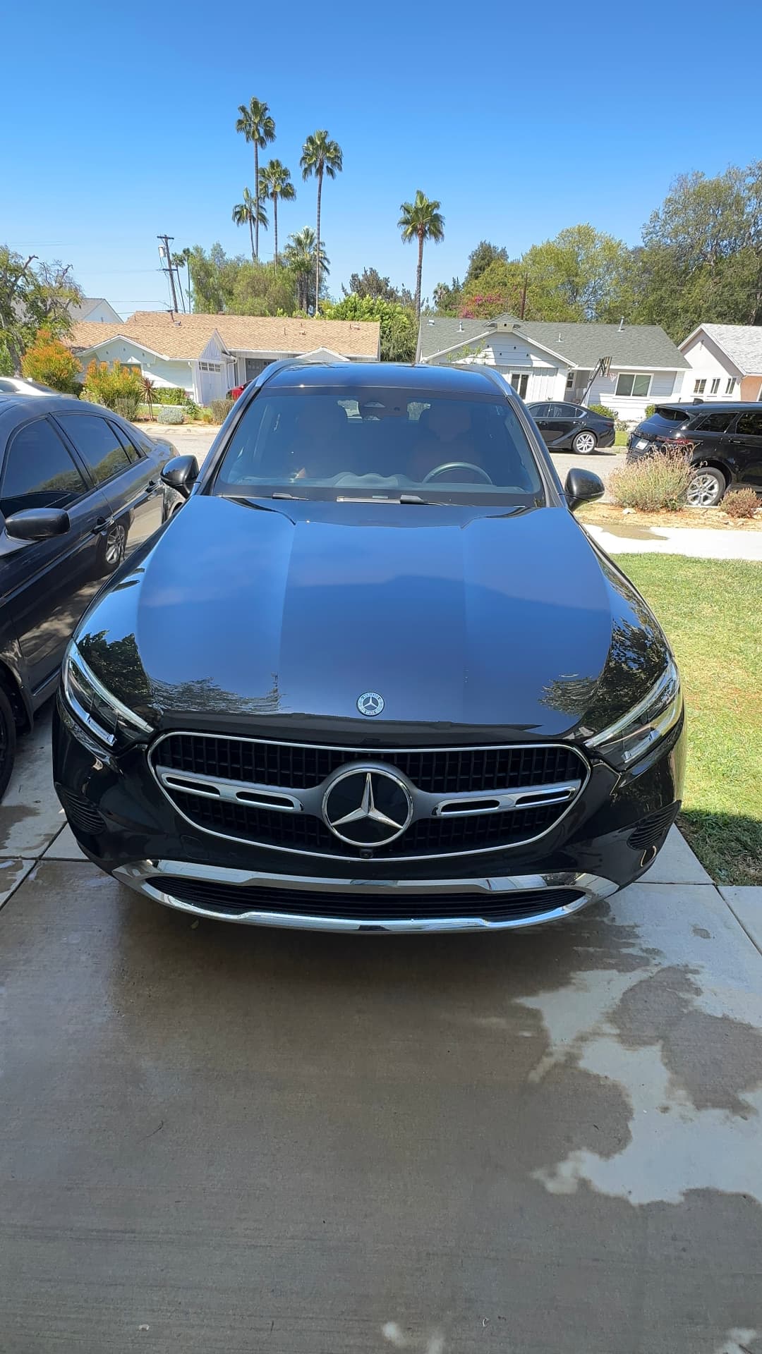 Black Mercedes-Benz sedan with fresh wax shine